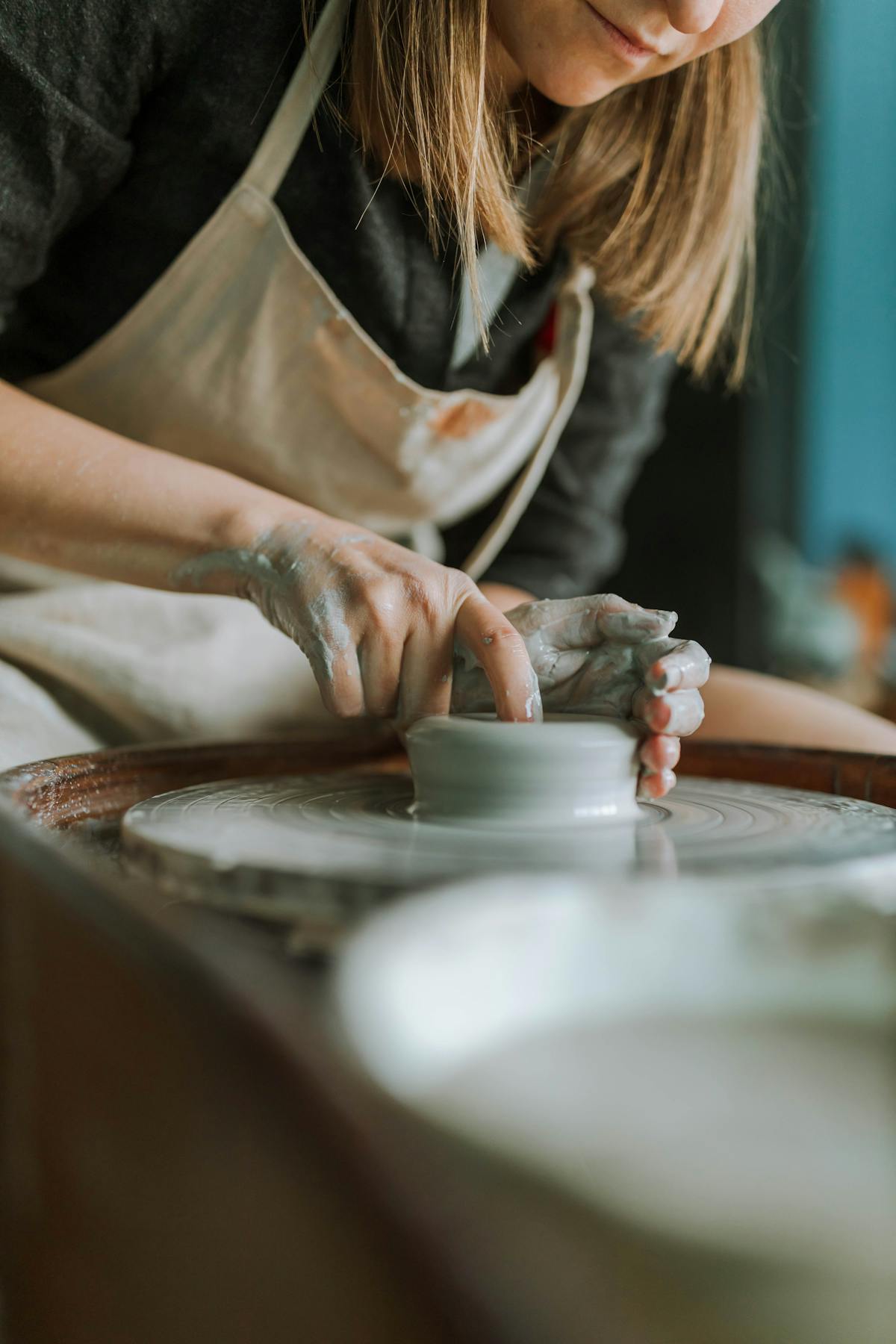 Woman Shaping a Soft Clay